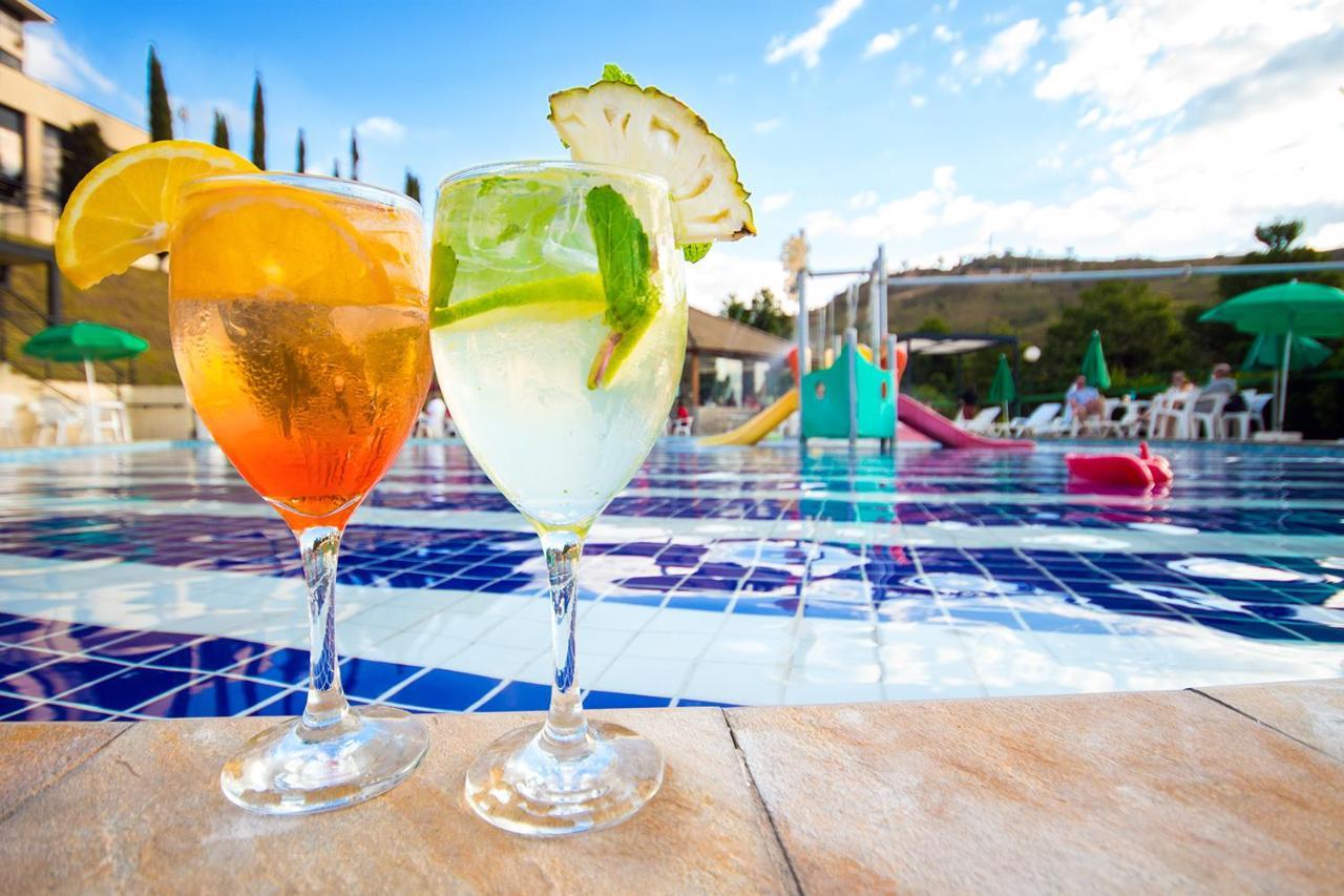 Hotel Golden Park All Inclusive Pocos De Caldas By Nacional Inn Exterior photo Two Aperol Spritz cocktails